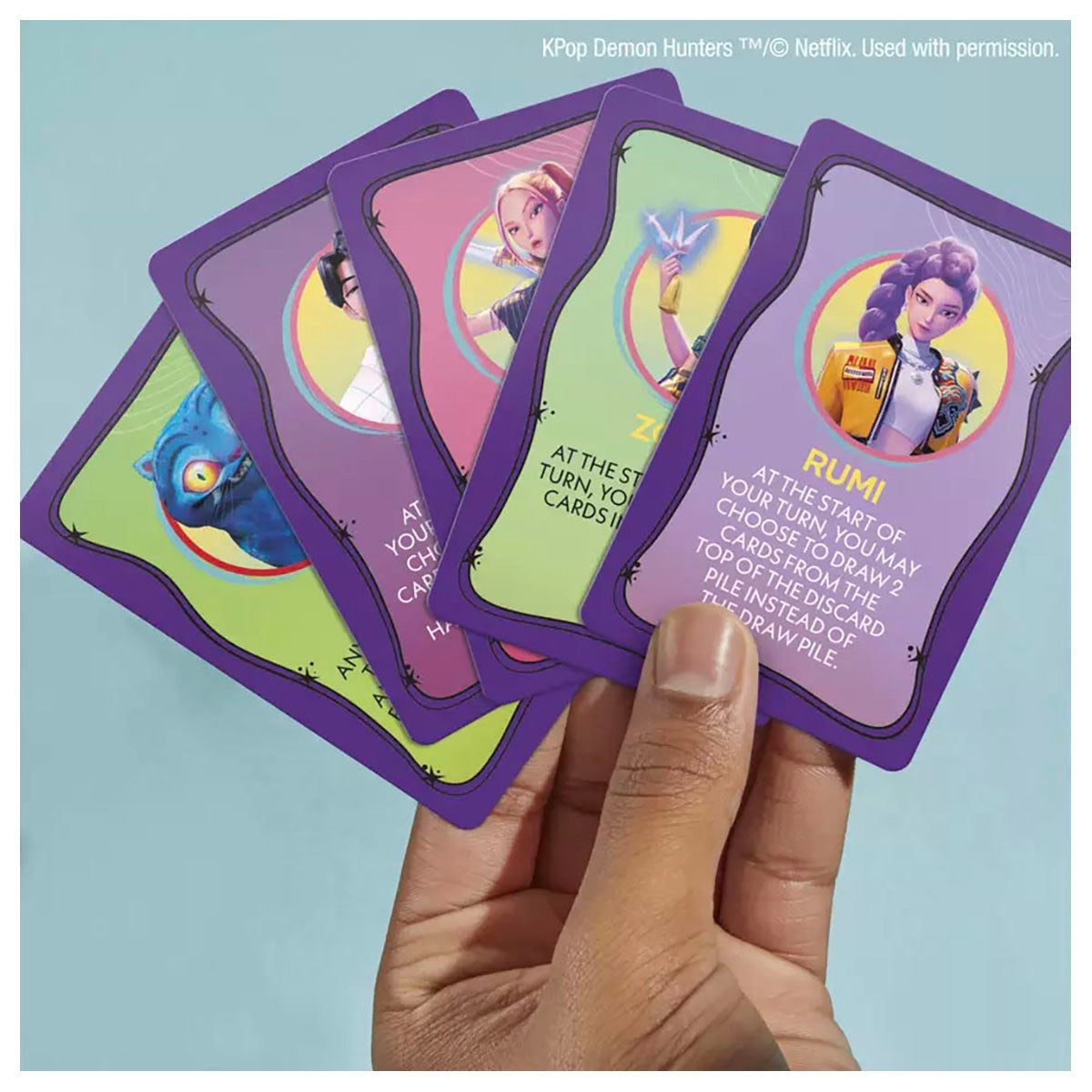 K-Pop Demon Hunters Monopoly Deal themed cards and gameplay setup