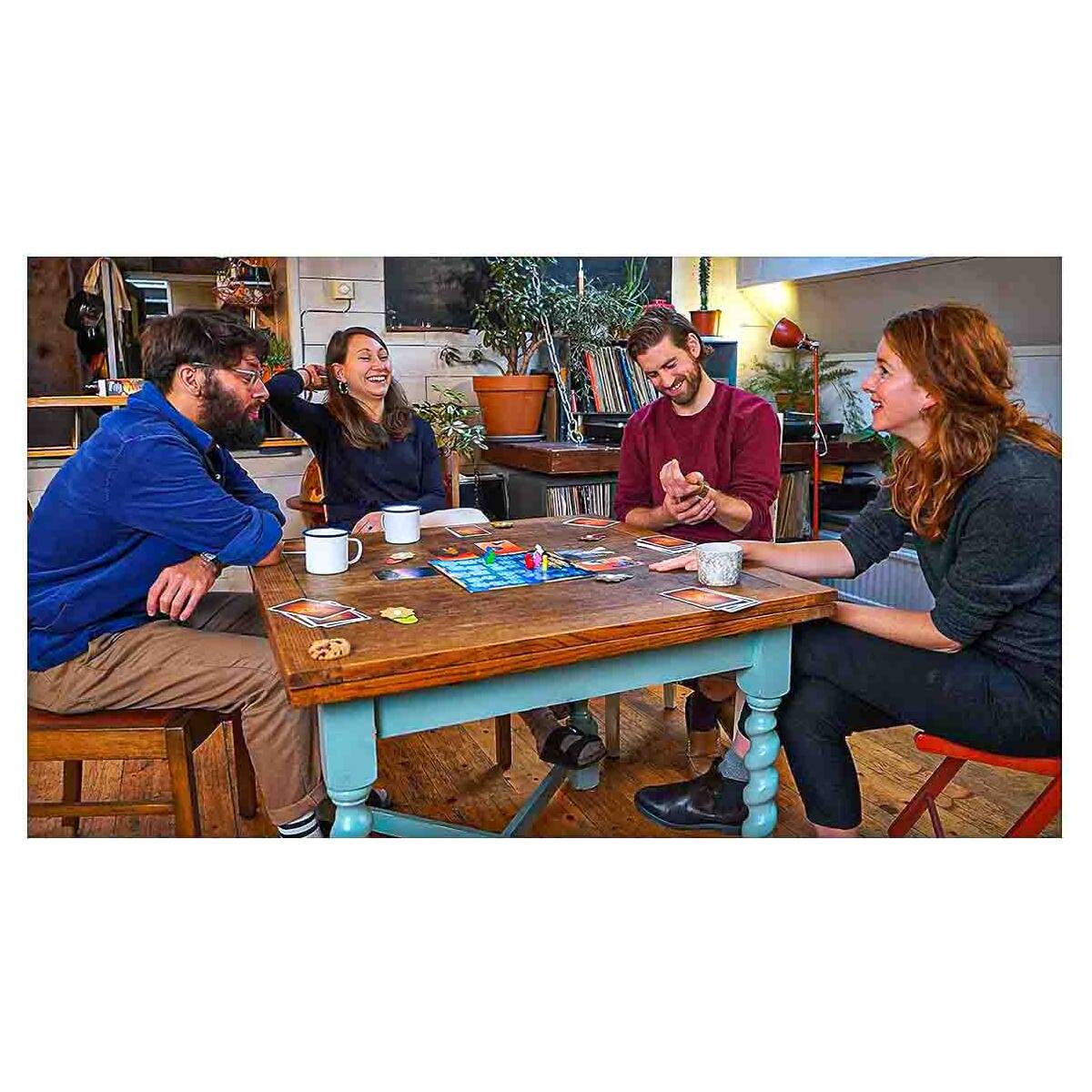 Players enjoying Dixit storytelling game