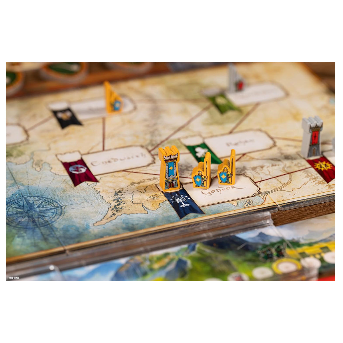 Close up of Middle‑Earth duel board and themed game pieces